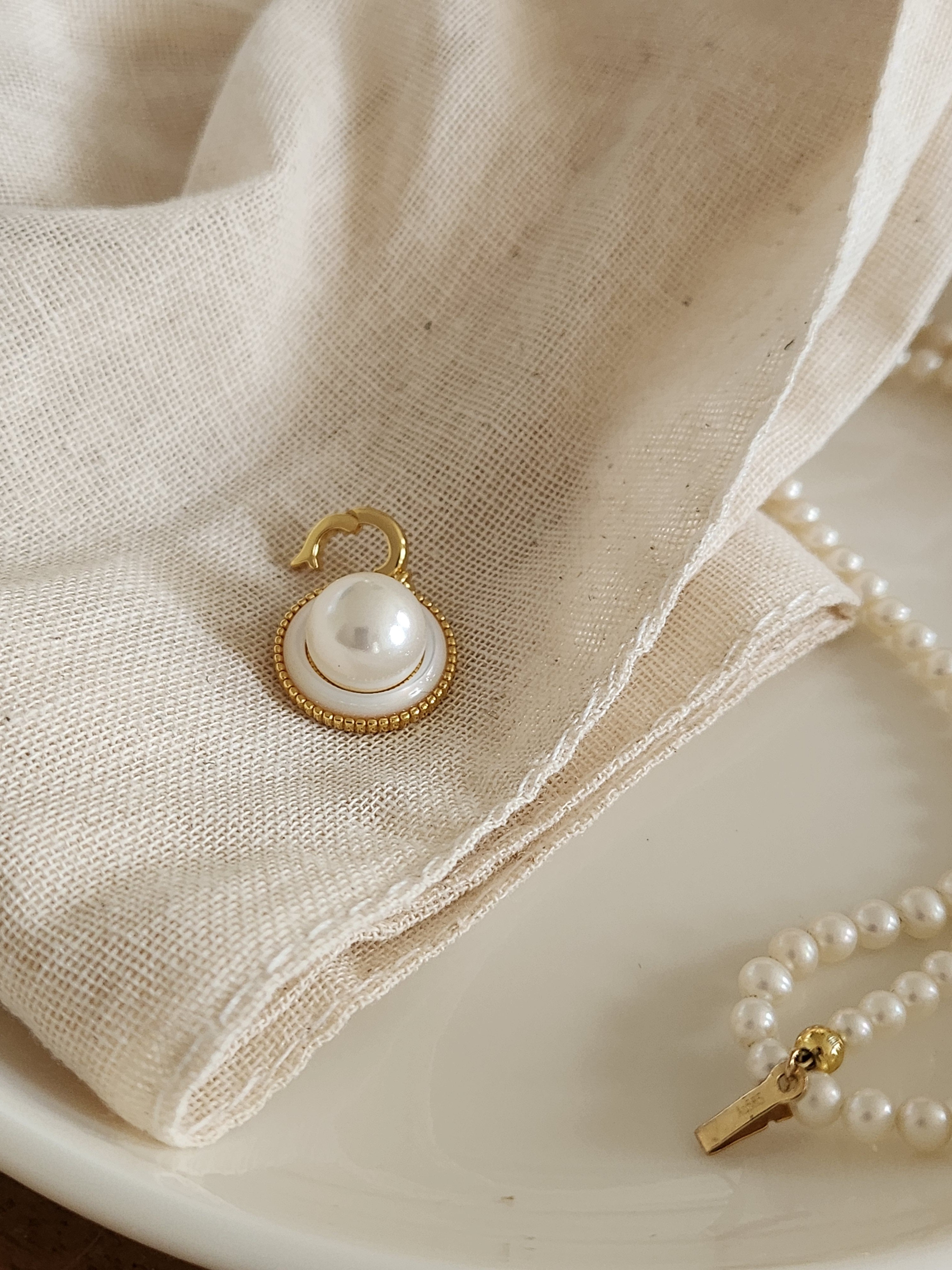 elegant golden single pearl charm