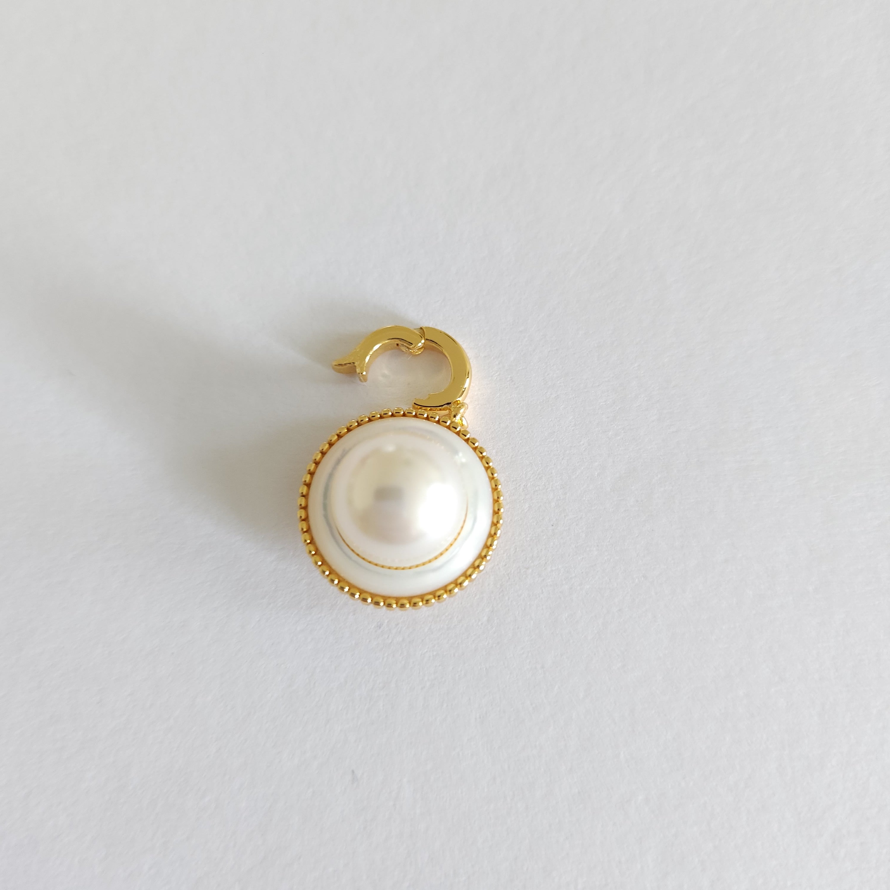 elegant golden single pearl charm