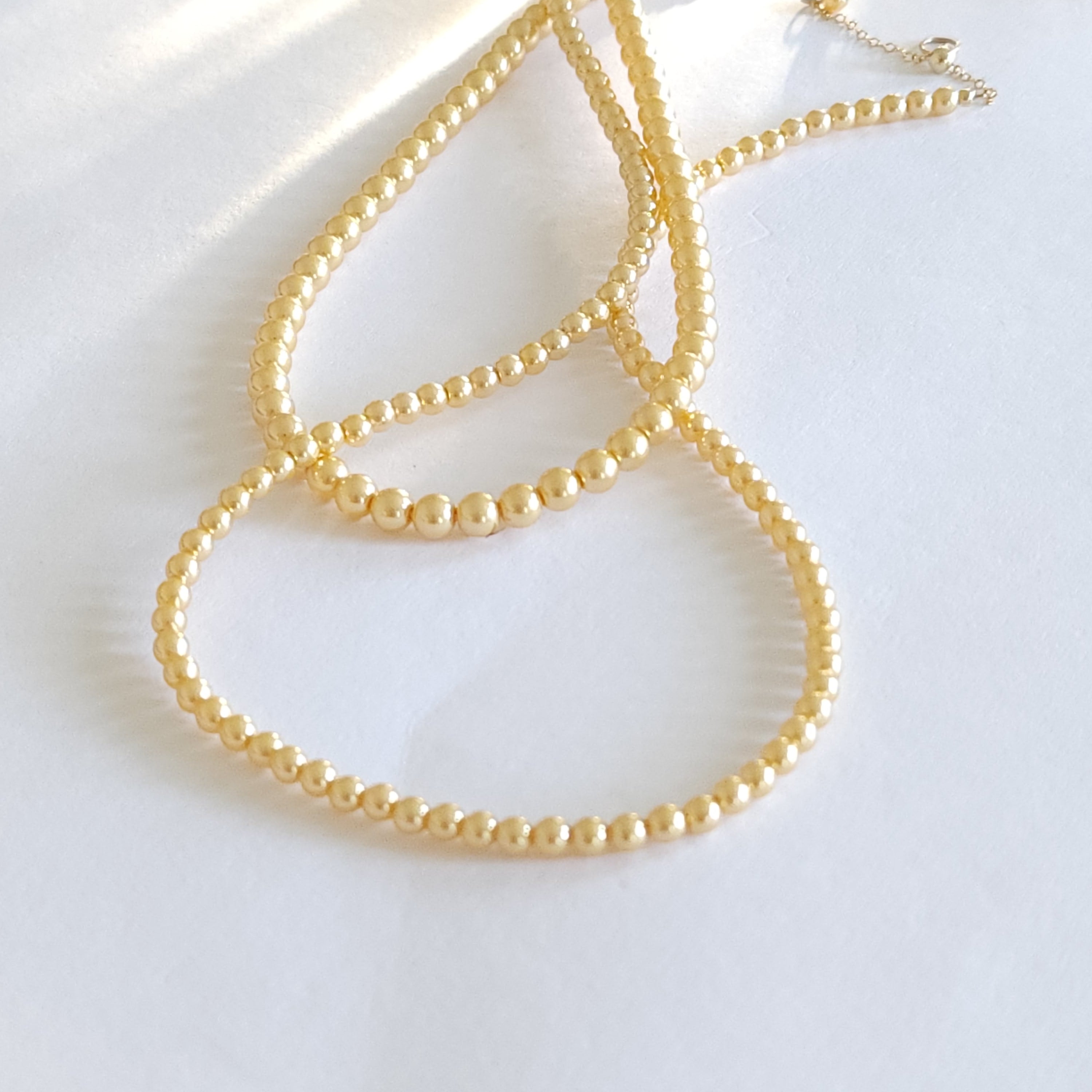 Golden crystal pearl necklace